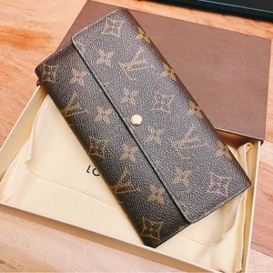 Authentic Louis Vuitton Sarah Wallet in monogram canvas